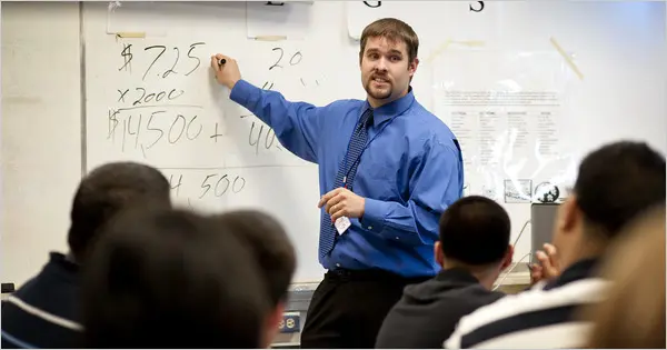 Teacher leading financial education session